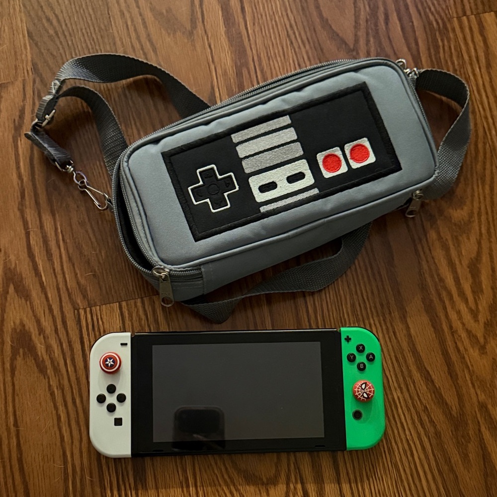 Nintendo Handheld Console with 4 remotes and accessories